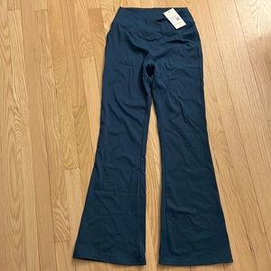 “Crossover high waisted back pocket super flare leggings” by HALARA